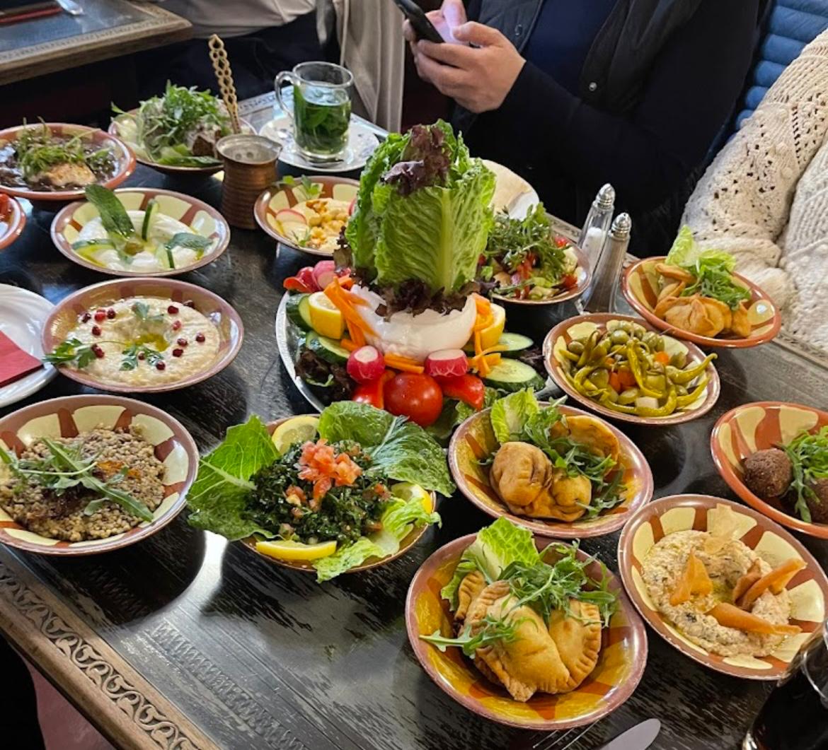 Lebanese mezze spread featuring multiple small dishes with traditional appetizers